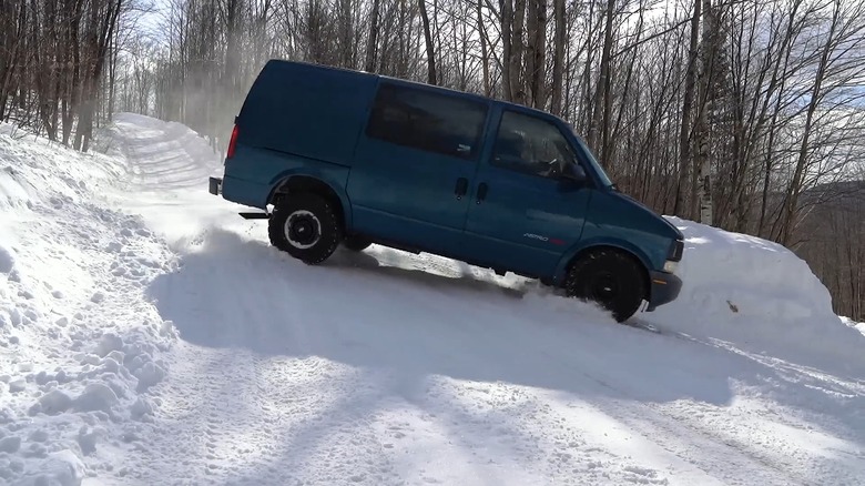 An AWD Astro Van on a snowy rally course