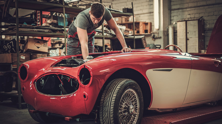 Mechanic working on classic car