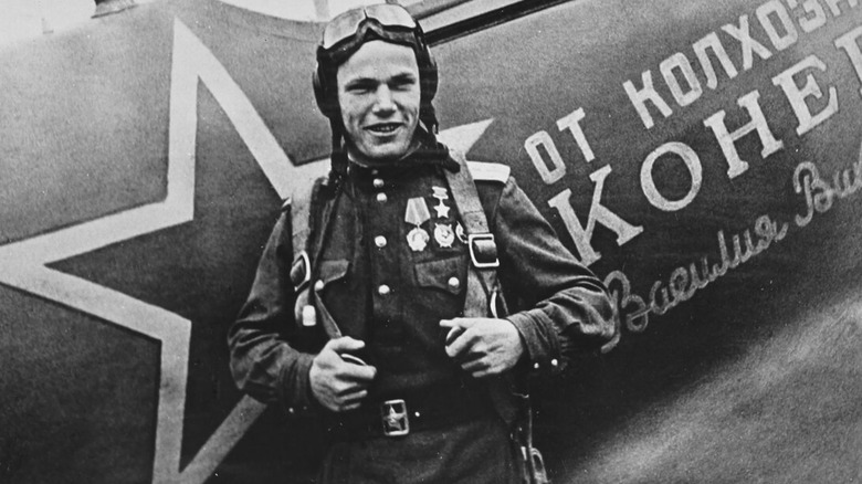 Soviet pilot Ivan Kozhedub standing in front of his Messerschmitt Bf 109 during WWII
