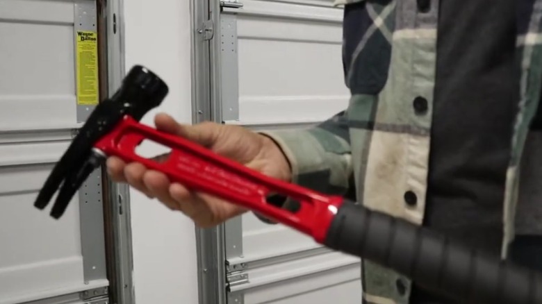 Person holding a Martinez Tool Company M1 hammer.
