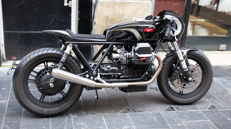 Side view of a cafe racer-style black Moto Guzzi