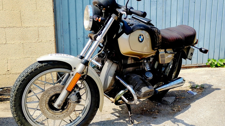 BMW R45 scrambler bike parked in sunny driveway