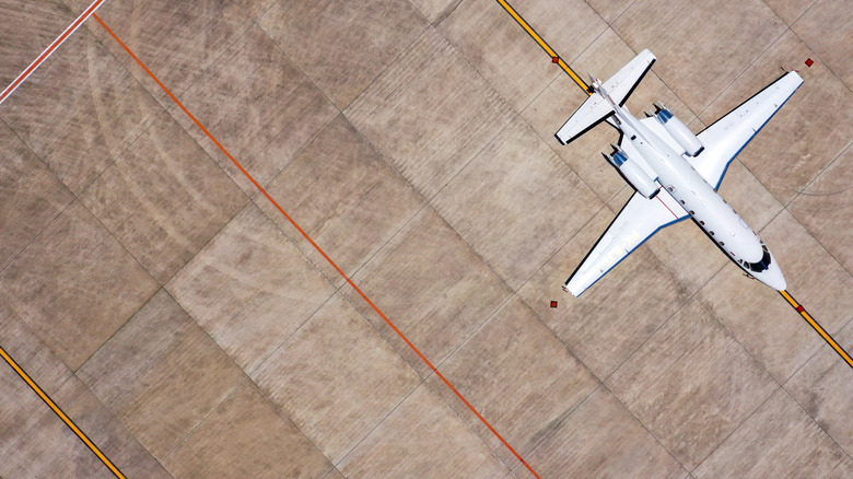 Overhead view of a private jet on a runaway
