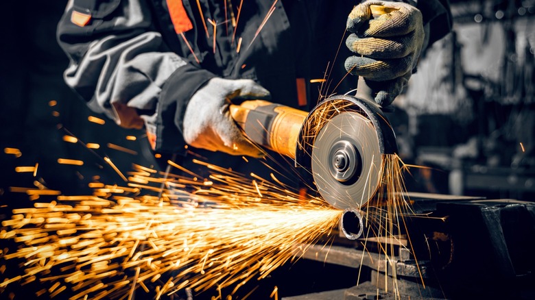 Angle grinder at work with sparks flying