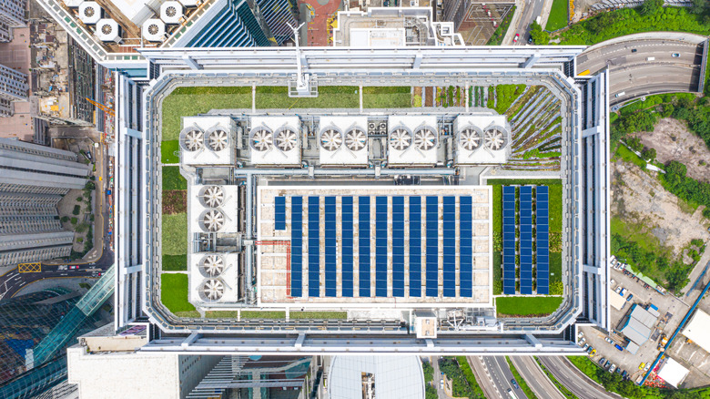 A large building with solar panels on the roof 