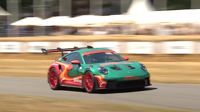 Dua Lipa's 911 Porsche racing on a track