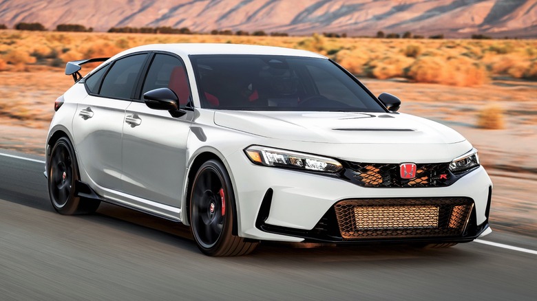 White 2023 Honda Civic Type R driving through the desert