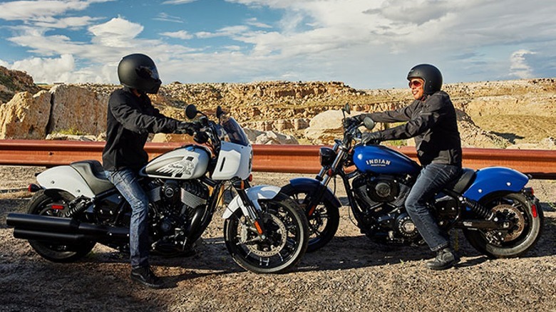 Two Indian motorcycle riders talking