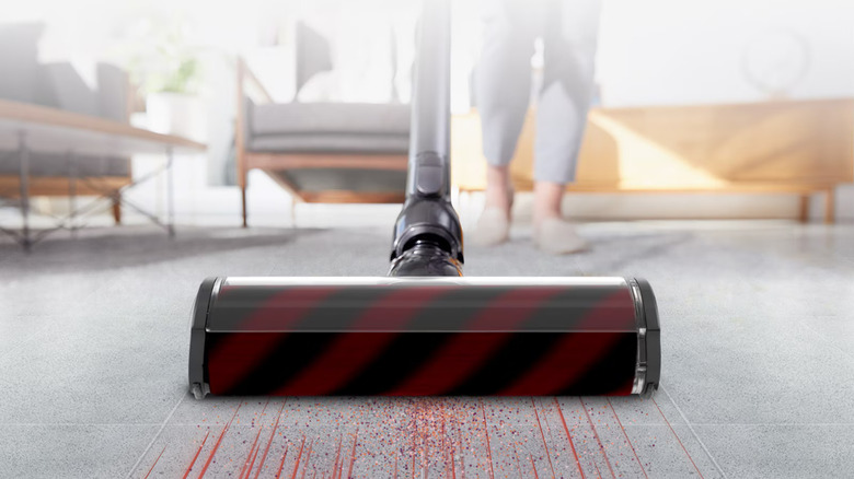 Woman cleaning carpet with LG CordZero vacuum