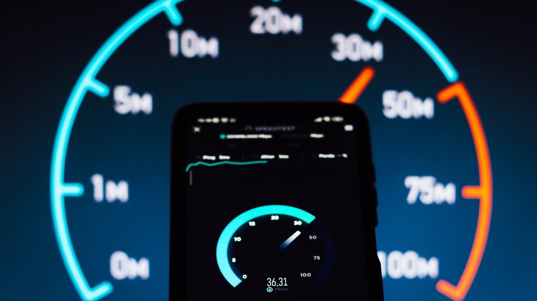 Internet speed test results displayed on computer and smartphone