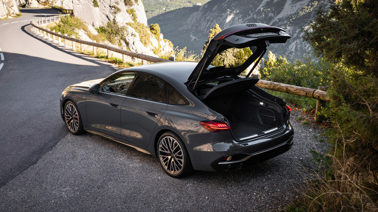 Rear 3/4 view of 2025 Audi A5 with rear hatch open