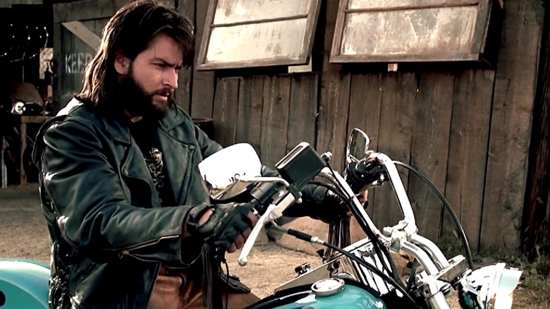 Charlie Sheen on a motorcycle