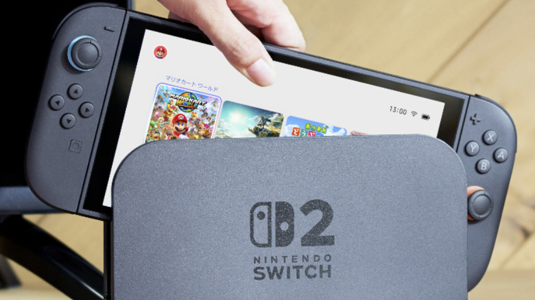 A Japanese-edition Nintendo Switch 2 being docked showing Mario Kart World and Tears of the Kingdom on the screen.