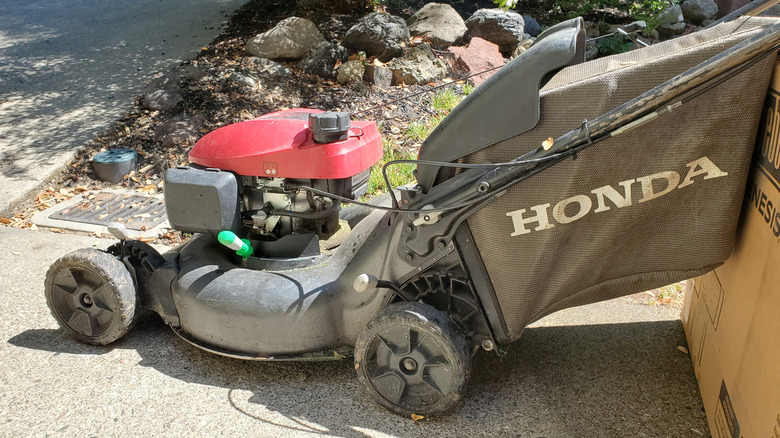 Honda lawn mower on pathway