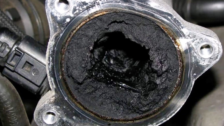 An engine component with visible carbon build-up