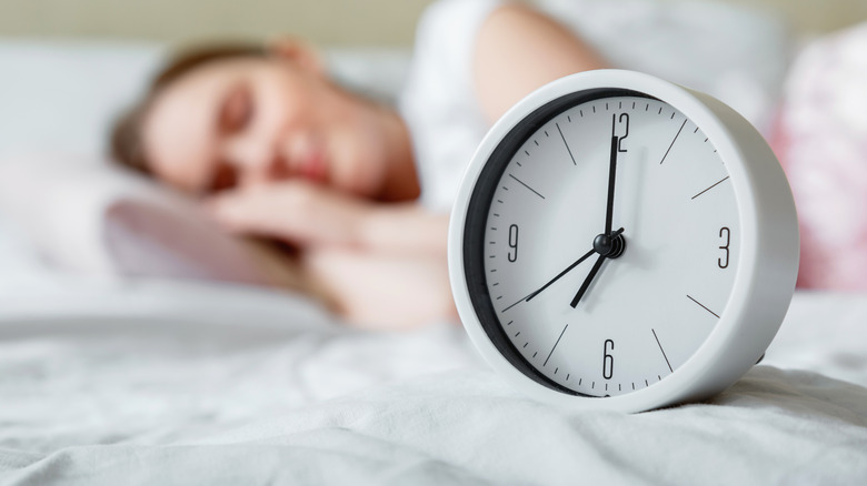 Alarm clock on bed