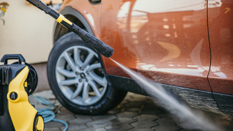 Using yellow pressure washer on orange car