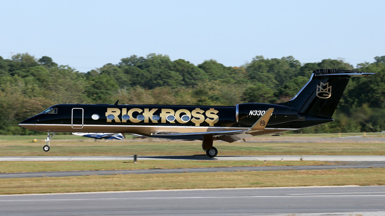 Rick Ross' private jet taking off rom airport