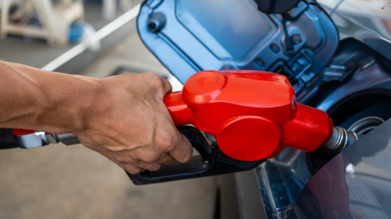Man pumping gas