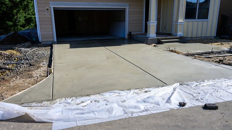 Driveway being installed in residential neighborhood