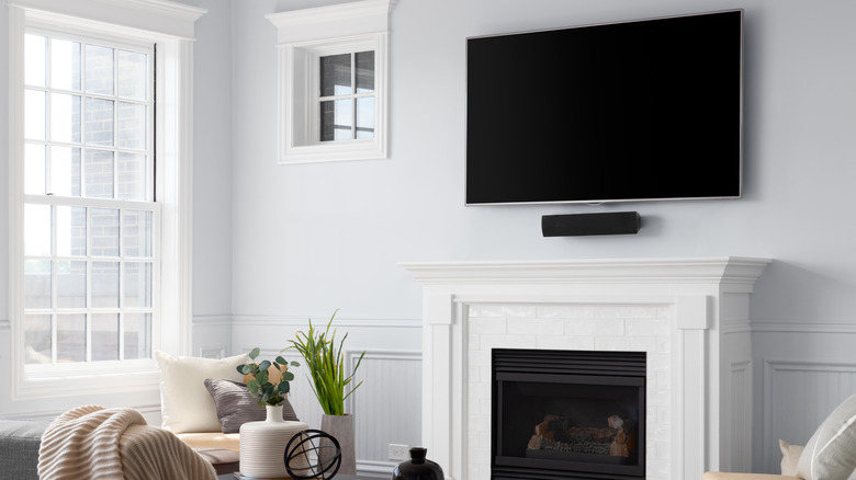 TV mounted above fireplace