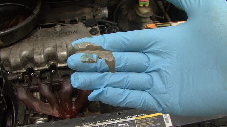 Oil on rubber gloved hand