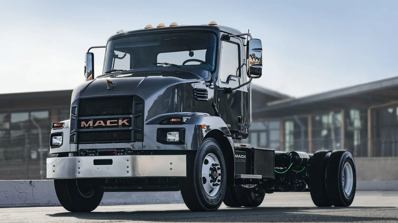 Front view of a black Mack MD Electric truck