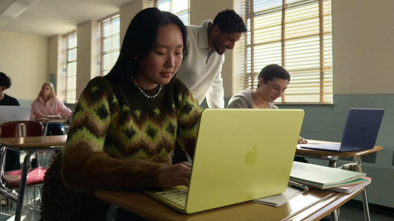 A female student working on a macbook neo