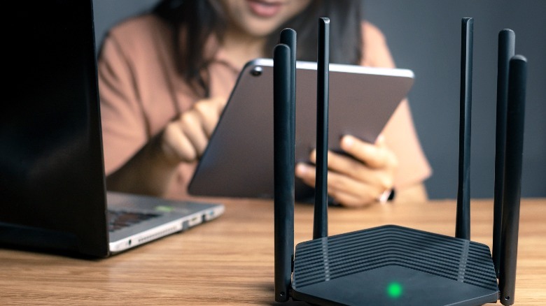Woman configuring a router on iPad