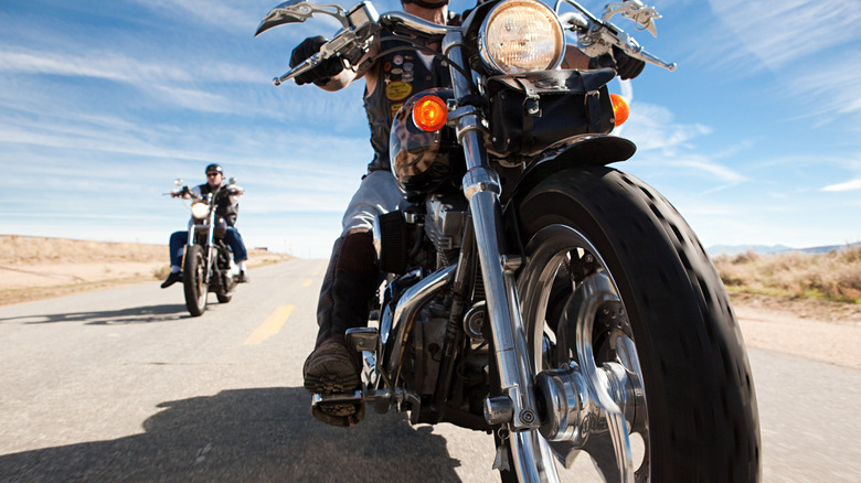 Men riding motorcyles open road