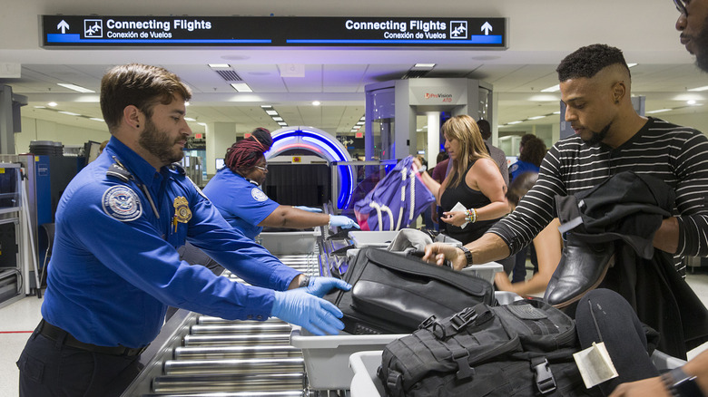 Airline passengers going through a TSA checkpoint