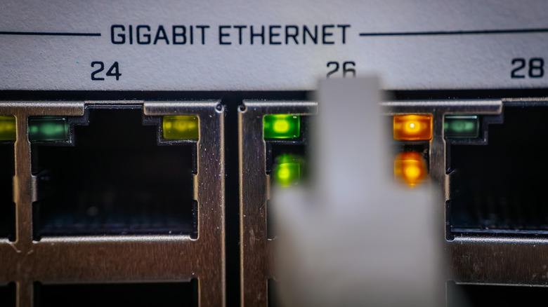 Gigabit ports on an ethernet switch with a cable being connected to one