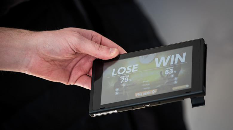 Person holding Nintendo Switch