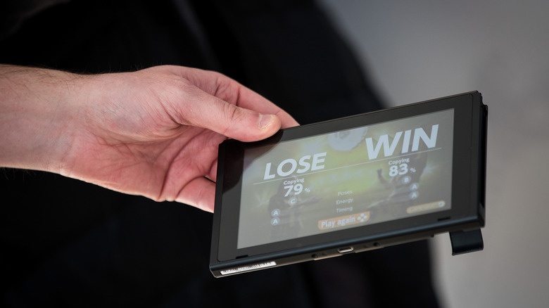 Person holding Nintendo Switch