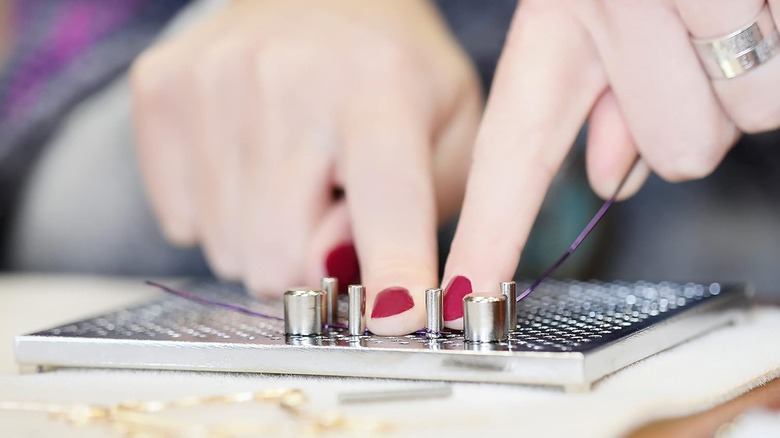 woman using wire jig
