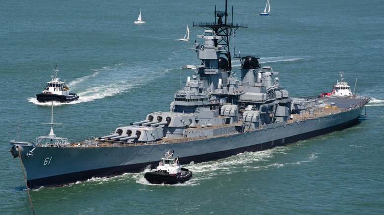 The USS Iowa (BB-61) making a course correction via tugs