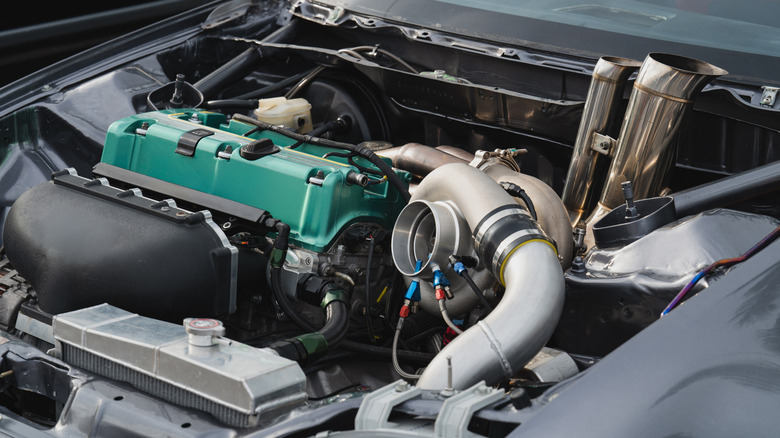 Close-up view of modified car engine with a turbocharger,