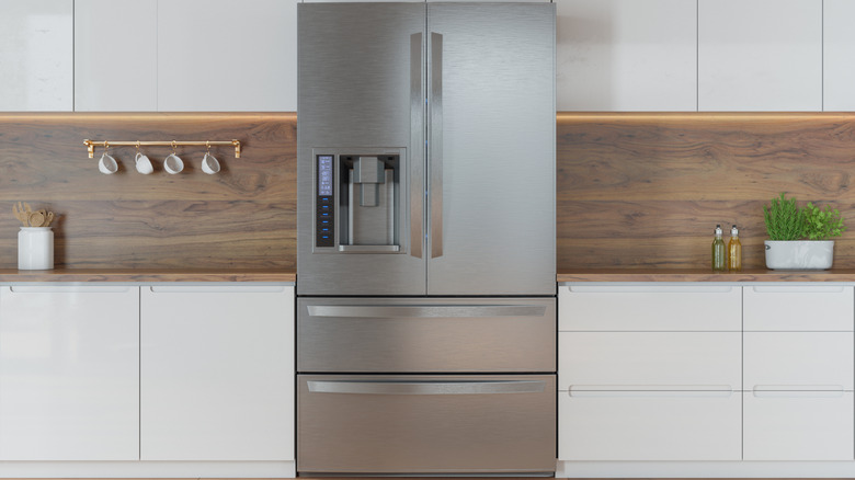 A refrigerator inside a modern kitchen