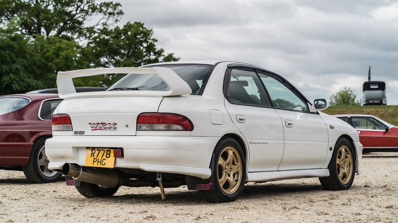 A white Subaru Impreza Turbo is displayed at the Chester Classic Car Auction.