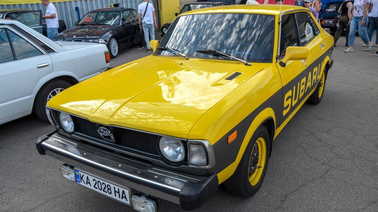 Yellow Subaru Leone with black racing stripes