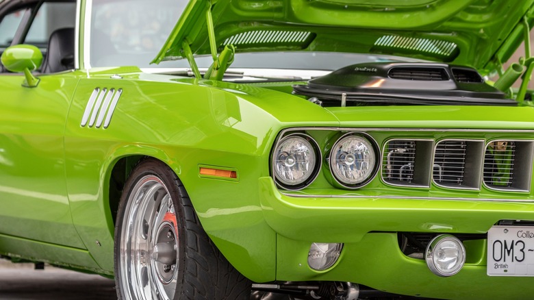 Bright green Hemi Cuda on display at a car show
