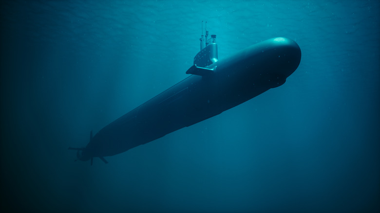 Military nuclear submarine moving under water