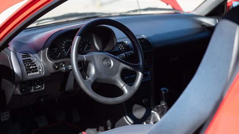 The interior of Mazda MX-3 from the driver's door