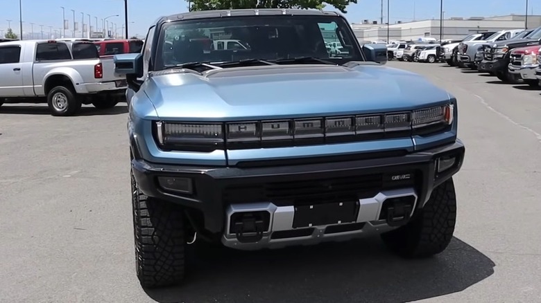 A 2024 Hummer EV 3X Omega Edition with the sun glinting off its hood.