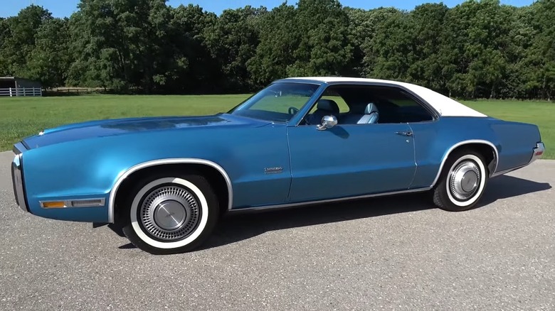 Blue 1970 Oldsmobile Toronado GT parked