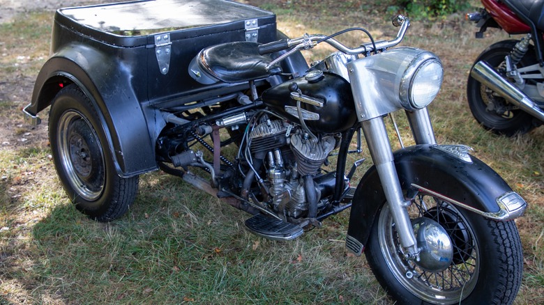 Harley-Davidson Servi-Car parked on grass field