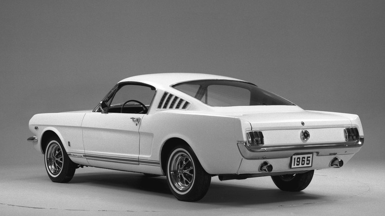 Rear 3/4 view of 1965 Mustang GT in studio setting