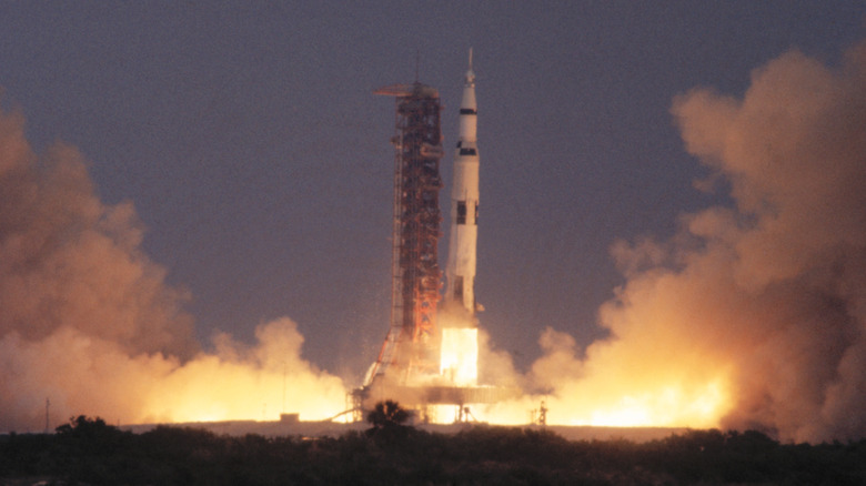 General view of scene from press site as the Saturn rocket lifts the Apollo 13 spacecraft
