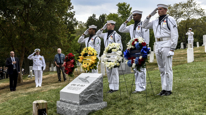 Four sailors saluting the USS Thresher memorial, Arlington cemetary