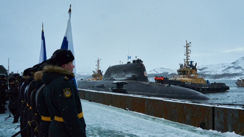 Russian mlitary personnel looking at the K-564